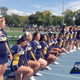 Members of the Buena Vista cheer team, including Alyssa Parker, kneel during the game on Sept. 30, 2017, against Luther College at J. Leslie Rollins Stadium in Storm Lake, Iowa. (KCCI-TV screenshot)
